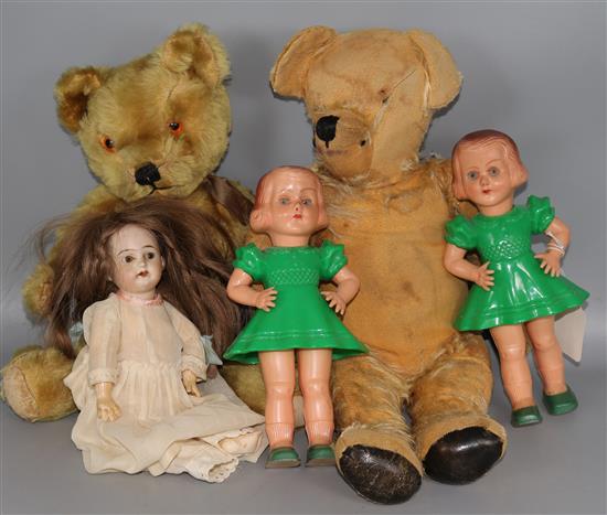 2 teddy bears, a doll and 2 plastic dolls
